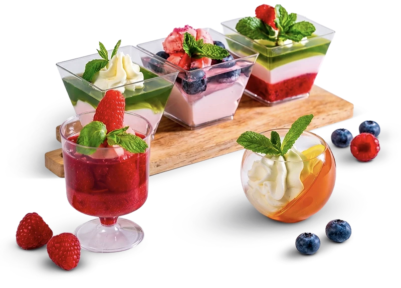 Assorted Tiny Indulgence handcrafted dessert cups with berries, cream, and mint